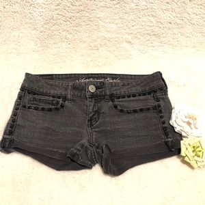 Distressed black washed Jean shorts with studs